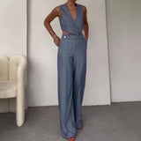 Sea blue sleeveless high-waist backless formal jumpsuit in XL size, featuring a fitted waist and wide-leg design, elegantly highlighting the shoulders and neckline.