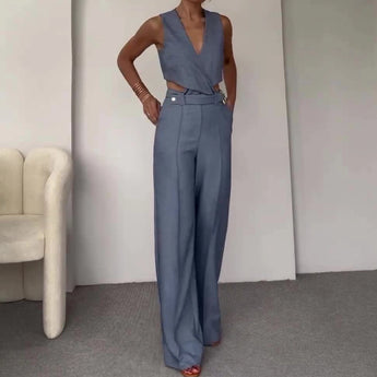 Sea blue sleeveless high-waist backless formal jumpsuit in XL size, featuring a fitted waist and wide-leg design, elegantly highlighting the shoulders and neckline.