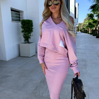 Light blue sleeveless midi dress styled with sunglasses, showcasing a chic summer fashion outfit.