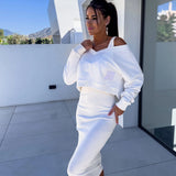 
A model wearing a light blue sleeveless midi dress, ideal for chic summer fashion, standing against a bright sky. The dress features a fitted waist and is styled in an elegant formal wear look, emphasizing a fashionable and sophisticated design.