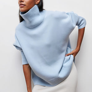 Light blue turtleneck poncho sweater with chic oversized collar, shown in XXL size.
