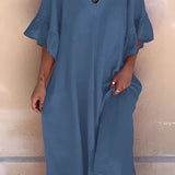 A model wearing a dark blue V-neck ruffle sleeve loose fit summer dress made of cotton, suitable for plus sizes, displayed in a 3XL size.