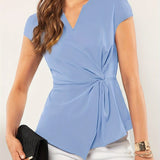 Light blue V-neck twist-front blouse for women with short sleeves, modeled on a person.