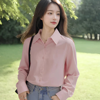 Light blue women's blouse with a minimalist design, featuring a classic collar and long sleeves, suitable for casual and office wear.