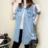 Light blue women's denim shirt dress in a casual oversized tunic style, featuring long sleeves and a collared neckline, available in size 4XL/50.