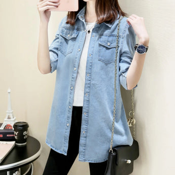 Light blue women's denim shirt dress in a casual oversized tunic style, featuring long sleeves and a collared neckline, available in size 4XL/50.