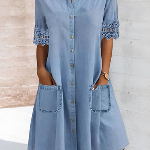 Light blue women's denim shirt dress featuring lace trim and pockets, with long sleeves and a collared neckline.