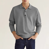 Light gray men's long sleeve knit polo sweater in a relaxed fit, featuring a collar and ribbed cuffs, designed for a comfortable and stylish look.