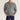 Light gray men's long sleeve knit polo sweater in a relaxed fit, featuring a collar and ribbed cuffs, designed for a comfortable and stylish look.