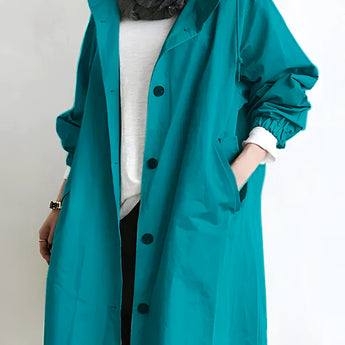 Light gray oversized double-breasted trench coat for women with long sleeves and a wide collar, designed in an elegant fashion style, showcased in the 3XL size variant called Evergreen.