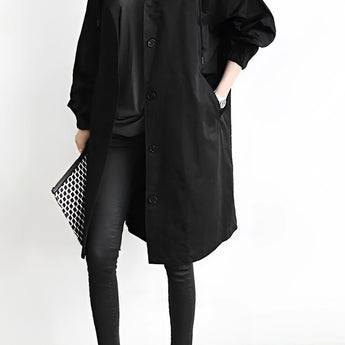 Light gray women's oversized double-breasted trench coat with a classic collar and long sleeves.