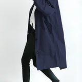 Light gray oversized double-breasted trench coat for women, styled with a marine blue hue in size 3XL, showcasing its long sleeves and fashionable design.