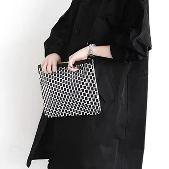 
A black oversized double-breasted trench coat for women in size 3XL, featuring a stylish collar and long sleeves, worn by a model shown from the waist up.