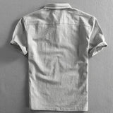 Light grey men's short sleeve linen dress shirt with mandarin collar and buttons, breathable fabric.