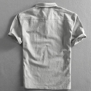 Light grey men's short sleeve linen dress shirt with mandarin collar and buttons, breathable fabric.