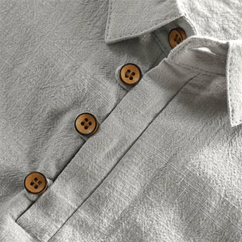 Light grey men's short sleeve linen dress shirt with a mandarin collar, breathable fabric.