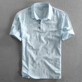Light grey men's short sleeve linen dress shirt with a mandarin collar, featuring a breathable fabric and buttons down the front.
