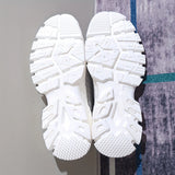 Light grey women's fashion sneakers with breathable mesh upper and cushioned sole.