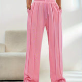 Light pink high-waist joggers for women in size XXL, featuring a stylish design with a comfortable fit around the waist and legs.