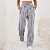 Light pink high-waist joggers for women, featuring a stylish and comfortable design with an elastic waistband and tapered legs.