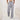 Light pink high-waist joggers for women, featuring a stylish and comfortable design with an elastic waistband and tapered legs.