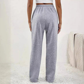 Light pink high-waist joggers for women, featuring a stylish design with an elastic waistband and a comfortable, relaxed fit.