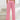 Women's light pink high-waist joggers featuring a stylish and comfortable design, highlighting elements like the waistband and knee area, with a focus on a soft, peachy pink color.