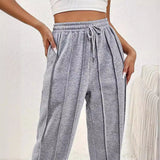 Light pink high-waist joggers for women, featuring a stylish and comfortable design with a snug waist fit.