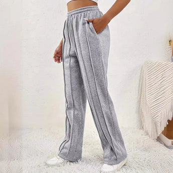 Light pink high-waist joggers for women, featuring a stylish and comfortable design with an elastic waistband and a relaxed fit, suitable for casual wear or active use.