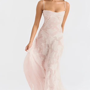Light pink lace floral gown with elegant detailing, suitable for romantic summer evenings. The dress features a flattering neckline, fitted waist, and delicate sleeves, creating a graceful silhouette.