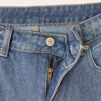 Light-wash high-waist denim jeans in faded blue, featuring a classic five-pocket design.