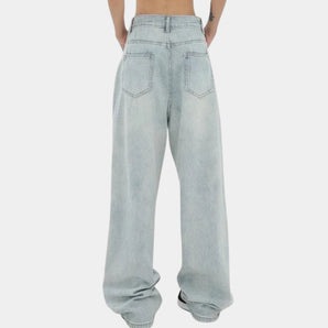 Light-wash high-waisted baggy jeans with elastic cuffs, showcasing a relaxed fit through the legs and made from denim fabric in a light blue shade.