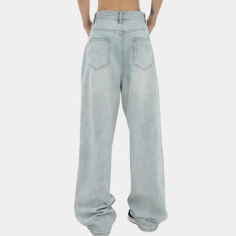 Light-wash high-waisted baggy jeans with elastic cuffs, showcasing a relaxed fit through the legs and made from denim fabric in a light blue shade.