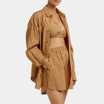 Light yellow women's oversized silk shirt with a striped pattern, featuring a classic collar and long sleeves. The luxurious, soft-touch fabric drapes elegantly, designed for a comfortable fit in an XL size.