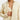 Light yellow women's oversized silk shirt with a luxurious soft touch, featuring long sleeves, a classic collar, and button detailing, styled as formal outerwear.
