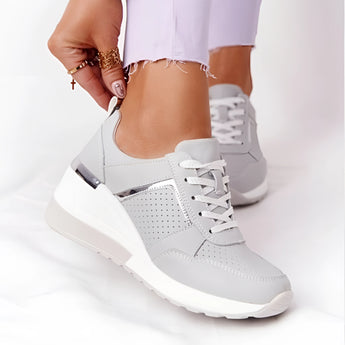 Lightweight gray women's low-top fashion sneakers with a chic and breathable design, featuring a sporty style suitable for walking.
