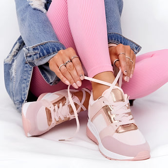 A pair of lightweight beige women's low-top fashion sneakers in size 43 with pink accents, showcasing a chic and breathable design.