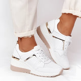 Lightweight beige and white women's low-top fashion sneakers with a chic and breathable design, ideal for walking and sportswear, featuring a stylish silver accent.