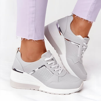 Lightweight beige women's low-top fashion sneakers with a chic and breathable design, suitable for walking and casual wear.