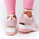 Lightweight beige women's low-top fashion sneakers with a chic and breathable design, worn on a person's foot against a neutral background.