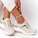 Lightweight beige women's low-top fashion sneakers with a chic and breathable design, featuring white and pink accents.