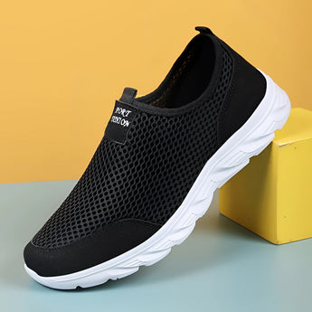 Lightweight grey slip-on walking shoes designed for athletic use, featuring a breathable mesh upper and durable synthetic rubber sole, suitable for outdoor activities and sports.