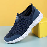Lightweight breathable slip-on walking shoes in blue, featuring an athletic sneaker design ideal for outdoor activities.
