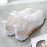 Lightweight mesh running shoes with black and white stripes, featuring a non-slip sole, displayed in a rose color, size 40.