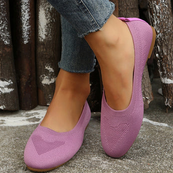 Purple lightweight ballet flats made of breathable mesh material, shown on a model's feet, suitable for summer walking.