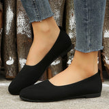 Lightweight black ballet flats featuring breathable mesh, ideal for summer walking, shown on a model's foot.