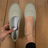 Lightweight pink ballet flats featuring breathable mesh design for comfortable summer walking, shown on a person's feet.