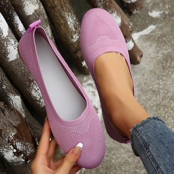 Lightweight pink ballet flats made of breathable mesh, designed for summer walking.