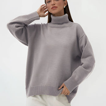 A person wearing a lime green chunky knit turtleneck sweater, demonstrating cozy winter fashion, with sleeves covering the arms and a relaxed fit around the waist. The sweater complements a light brown color scheme suitable for a large size. The person appears happy and comfortable, showcasing the sweater's stylish design.