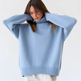 Lime green chunky knit turtleneck sweater featuring a cozy winter design, with emphasis on the turtleneck and long sleeves, displayed on a mannequin or model.